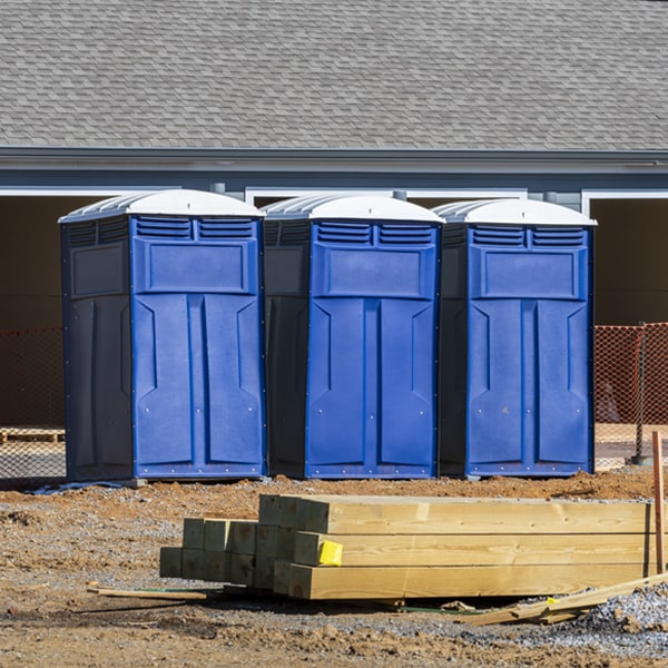 what is the cost difference between standard and deluxe portable toilet rentals in Covington